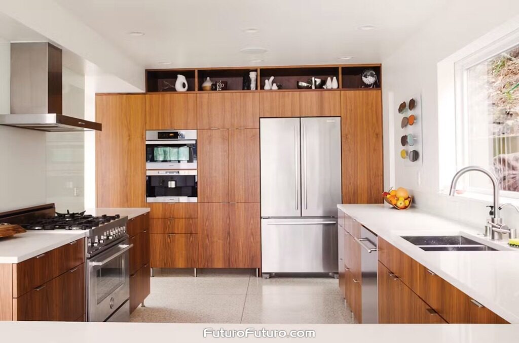 A stainless steel Futuro Futuro 36 inch Positano wall range hood is mounted on the left wall above a gas range with black grates. Warm vertical-grain walnut cabinets, white counters, a stainless French-door refrigerator, and a window over the sink fill this Seattle, Washington kitchen.