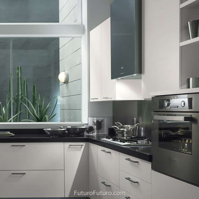 black and white kitchen range hood | Black quartz countertops wall mount range hood