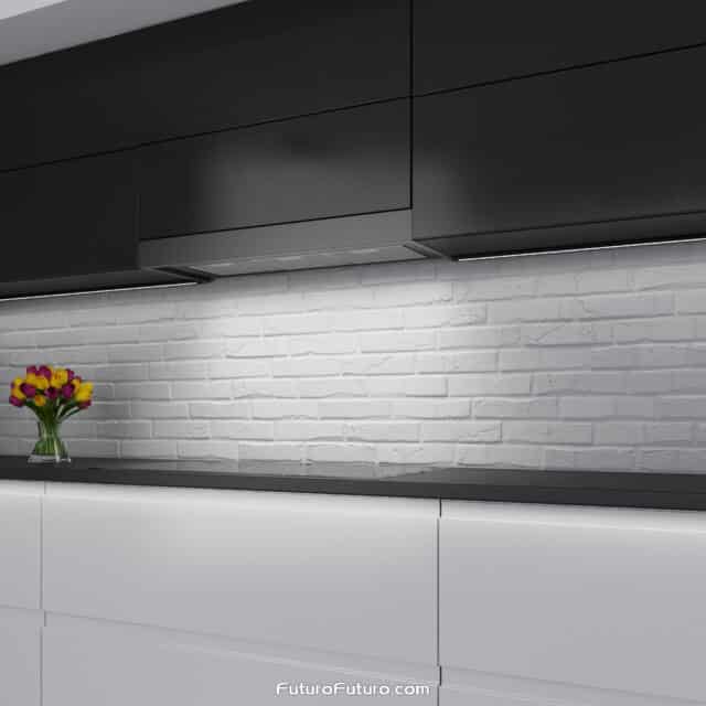 Counter Black Wall Range Hood blending perfectly in a black themed kitchen