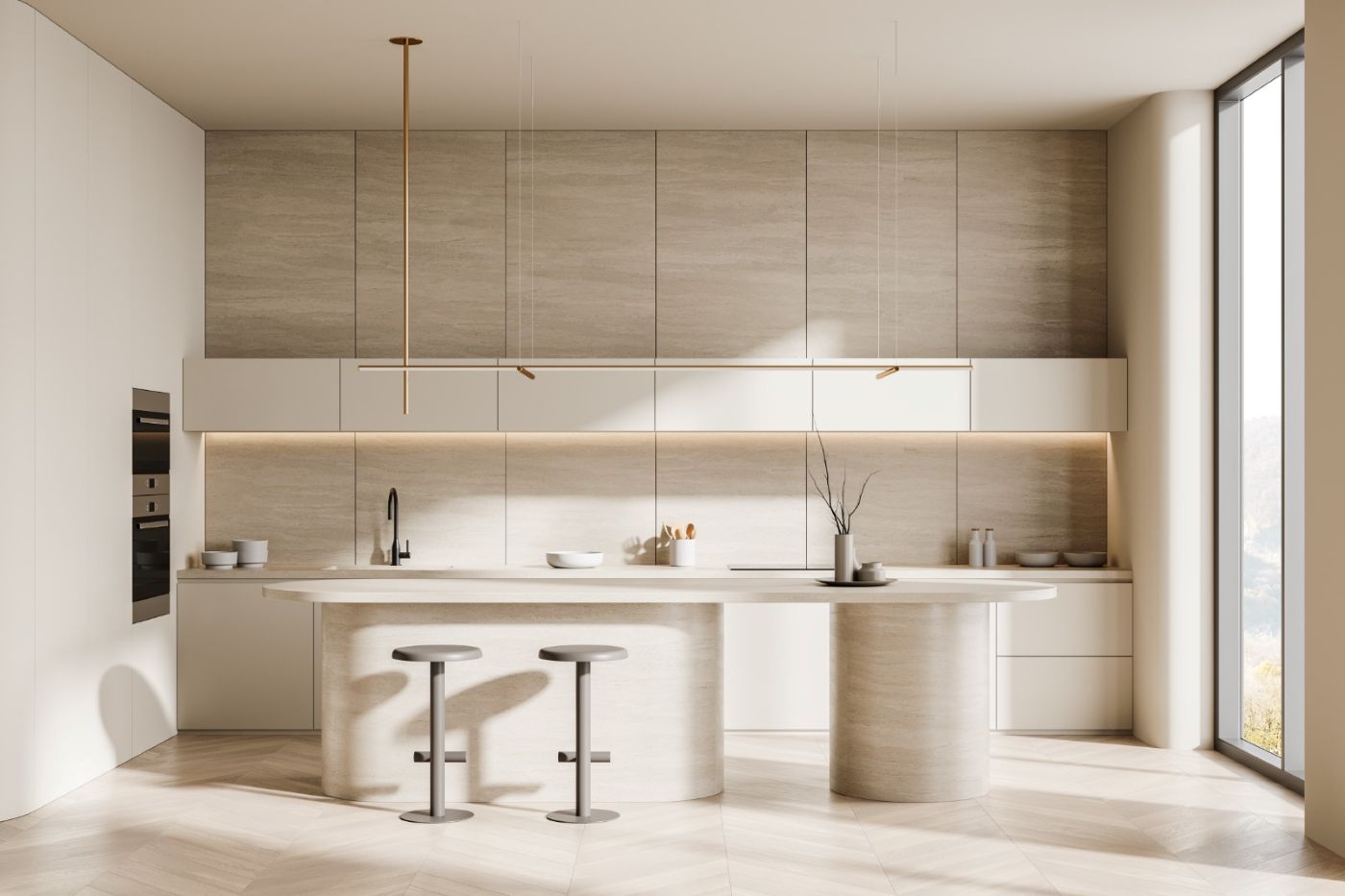 Modern minimalist kitchen interior featuring a kitchen ventilation trends 2027: a large beige travertine stone island, flat-panel light wood cabinetry, under-cabinet lighting, thin minimalist pendant lights, and two bar stools on a light herringbone wood floor.